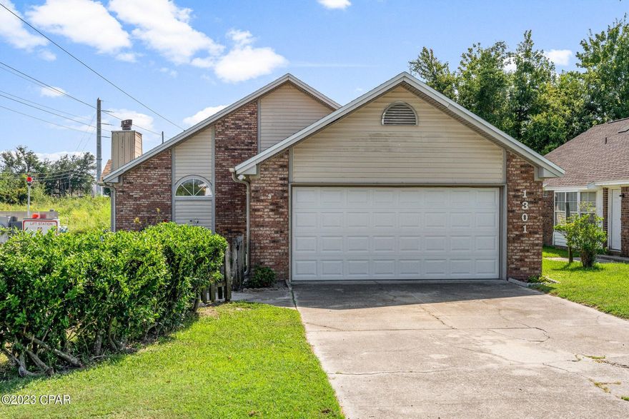 You will enjoy this light and bright 2 bedroom 2.5 bath home centrally located in the heart of Panama City.  This home is situated on a corner lot and features 2 bedrooms that each feature an ensuite bathroom, cathedral ceilings, tile and lvp throughout, wood burning fireplace, large dining area, kitchen with newer appliances, breakfast bar, pantry, new walk in shower in master, walk in closet in master, sun room porch, covered deck and 2 car garage with pull down stairs and attic storage.  The house has solar panels that will be paid off at closing that reduce the electric bill to a nominal base fee of $30 per month, the water heater is on gas, and the roof is 2009.  The house has gutters as well.  Washer and Dryer connection is in the garage. One of the highlights is the view from the living room of the utility easement.  It feels very private and peaceful.  A current survey is available.  Book your showing today!