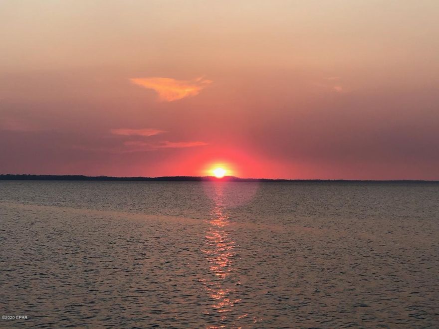 Fabulous waterfront lot overlooking the Bay in Kings Point, one of the most beautiful prestigious neighborhoods in Bay County. Perfect lot to custom build your dream home. The spectacular sunsets are truly like no other reflecting on the beauty of this waterfront lot.