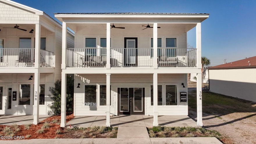 This unique commercial/residential property offers the perfect blend of convenience and comfort. Imagine living just steps from the shops and restaurants of downtown Port St Joe and the marina while running your business from the comfort of your home! The expansive 1,000 sq. ft. commercial space on the first floor provides a flexible canvas for your business needs. Design your dream workspace or lease it out for additional income. Upstairs, unwind in your private 1,500 sq. ft. sanctuary. The modern open floor plan features a large kitchen and living area, ideal for entertaining or relaxing. Three bedrooms and two baths provide ample space for you and your family. Short-term rentals are allowed! The living area boasts modern finishes throughout, including granite countertops, LVP flooring, and storm windows for year-round comfort. Brand new appliances are already installed for your move-in convenience. Take a refreshing dip in the complex's brand new, shared saltwater gunite pool - a perfect way to unwind after a long day.