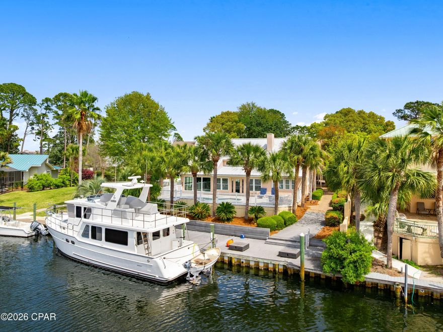 Located in the gated community of Bay Point, 1102 Redfish Circle offers an exceptional waterfront lifestyle with 80 feet of deep-water frontage and direct access to St. Andrews Bay, the gulf, and the Intracoastal Waterway. This three-bedroom, three-and-a-half-bath home spans 2,771 square feet and is ideally positioned on a quiet street before the neighborhood bridge, providing convenient boating access and a prime location within the community. Designed for both comfort and entertaining, the home features spacious living areas filled with natural light and beautiful water views throughout. The layout is thoughtfully designed, with a primary suite on the first floor. Upstairs, there are two bedrooms, each with its own bathroom, along with a second-floor living room for additional space for guests or relaxation. 

Step outside to enjoy your private swimming pool and waterfront setting, perfect for unwinding after a day on the water or hosting family and friends. Boaters will appreciate the easy access to open water and the short ride to Shell Island, making this property a true boater's paradise. The home also includes a rare three-car attached garage, offering ample space for vehicles, golf carts, and water toys, along with a large circular driveway for additional parking. 

Residents of Bay Point enjoy a secure, gated environment with close proximity to Bay Point Golf Club and the popular Bar 72 restaurant. Offered furnished, this home presents an opportunity to step into the waterfront lifestyle from day one.