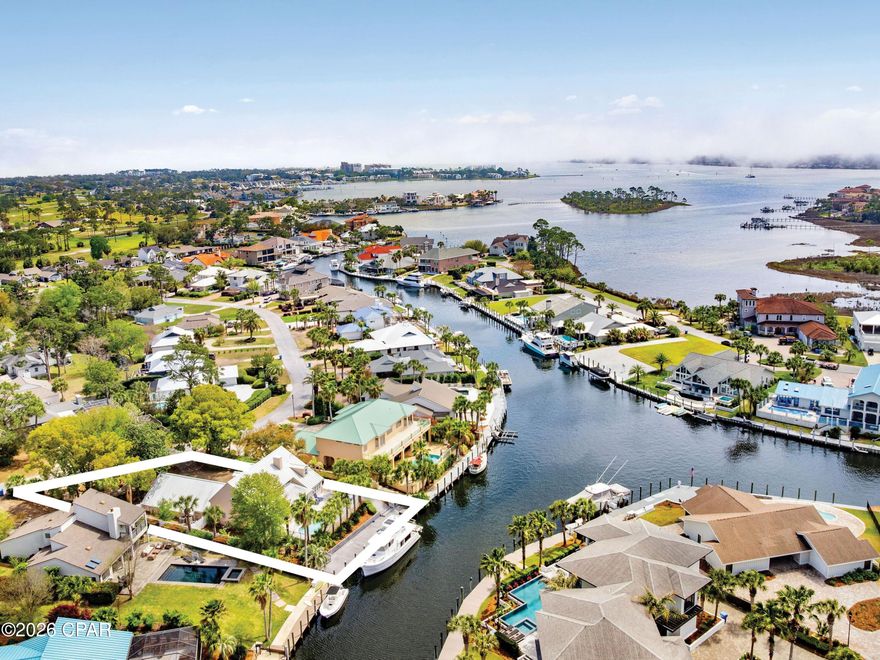 Located in the gated community of Bay Point, 1102 Redfish Circle offers an exceptional waterfront lifestyle with 80 feet of deep-water frontage and direct access to St. Andrews Bay, the gulf, and the Intracoastal Waterway. This three-bedroom, three-and-a-half-bath home spans 2,771 square feet and is ideally positioned on a quiet street before the neighborhood bridge, providing convenient boating access and a prime location within the community. Designed for both comfort and entertaining, the home features spacious living areas filled with natural light and beautiful water views throughout. The layout is thoughtfully designed, with a primary suite on the first floor. Upstairs, there are two bedrooms, each with its own bathroom, along with a second-floor living room for additional space for guests or relaxation. 

Step outside to enjoy your private swimming pool and waterfront setting, perfect for unwinding after a day on the water or hosting family and friends. Boaters will appreciate the easy access to open water and the short ride to Shell Island, making this property a true boater's paradise. The home also includes a rare three-car attached garage, offering ample space for vehicles, golf carts, and water toys, along with a large circular driveway for additional parking. 

Residents of Bay Point enjoy a secure, gated environment with close proximity to Bay Point Golf Club and the popular Bar 72 restaurant. Offered furnished, this home presents an opportunity to step into the waterfront lifestyle from day one.