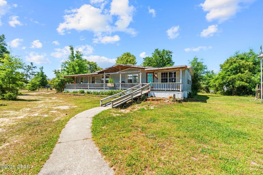 Excellent investment opportunity! This spacious 3BR/2BA manufactured home sits on a 0.68-acre lot in growing Youngstown, just minutes from Deer Point Lake. Featuring nearly 1,800 sq ft, an open layout, oversized master suite, covered front Patio, large rear deck, detached garage, and storage building — it's perfect for rental income, or your future home! Minimal property taxes and proximity to outdoor recreation make this a smart addition to any portfolio. No HOA and plenty of room for boats, RVs, or outdoor toys!