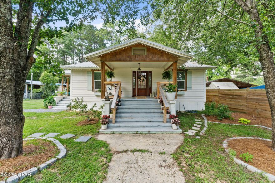 This is where country living meets convenience! Located just beyond the city limits of Bonifay, this homestead is ready for its new owners. Don't let the first glimpse fool you. This property is large, equipped, and ready for you and your animals. Beyond the 3 bedroom 2 bathroom farmhouse-style home is 7.91 acres, 20x36 pole barn walled up with a slab, 40x40 barn with electricity and stall, greenhouse, chicken Coop, fenced and cross-fenced pastures with water connections throughout, multiple garden areas (raised beds and in-ground), outdoor shower, fruit trees, a wooded area with trails for ATVs, and a spring-fed pond stocked with Bass, Bream, & Catfish. The home itself has been updated with a metal roof in 2017. The entire home was renovated in 2020 with continuous update since, to include new wiring, plumbing, tankless water heater, shiplap walls/ceiling, subflooring, windows, fixtures, hardware, doors, bathrooms, flooring, and more. The kitchen features stainless appliances to include a, dishwasher,  gas burning stove, freezer, wine cooler, and two compact refrigerators. It also features custom cabinetry which gives the home a unique feel and ties it together with a gorgeous wooden island top. The primary suite is open and airy and walks right out to the back porch. Relax on the porch or enjoy the evening by the fire pit out back. The fireplace inside the home is wood burning, but has never been used- functionality is not guaranteed. This property isn't located in the city limits, but it is serviced with city sewer and water. Located less than an hour from Panama City Beach, it is a quick drive to hop over to Highway 79 and enjoy a beach day!