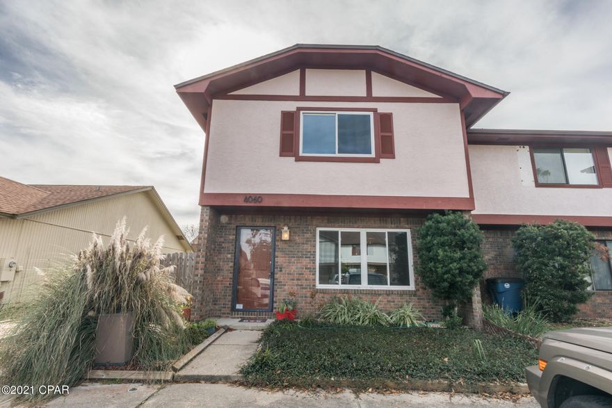 Location Location. This centrally located end unit townhome has been total remodeled. New light fixtures, granite kitchen counter tops, stainless appliances, beautiful breakfast bar. 1/2 bath located on the first floor and both upstairs bedrooms have their own private bathroom. Large walk in closets. The back yard has a privacy fence and is good size. Come see this beautiful home today!