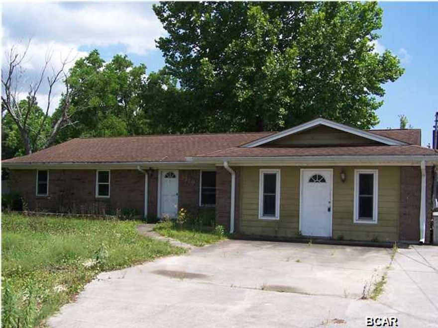 Very nice 3/2 all brick home just minutes to Panama City Mall. You will enjoy cooking in the newly updated kitchen that features ceramic tile flooring, granite counter tops, updated cabinetry with a stainless steel oven and a microwave overhead that flows into the dining room and family room that features a wood burning fireplace. Step outside through the french doors into the privacy fenced backyard that has an over-sized deck that will serve as annual spot for family gatherings. This home also offers a large den with a built-in bookcase that would make a great media room. Just reduced making this home very affordable with plenty of potential in a centrally located area, yet giving that rural feeling. The home is being sold in its AS IS condition. Make an offer.