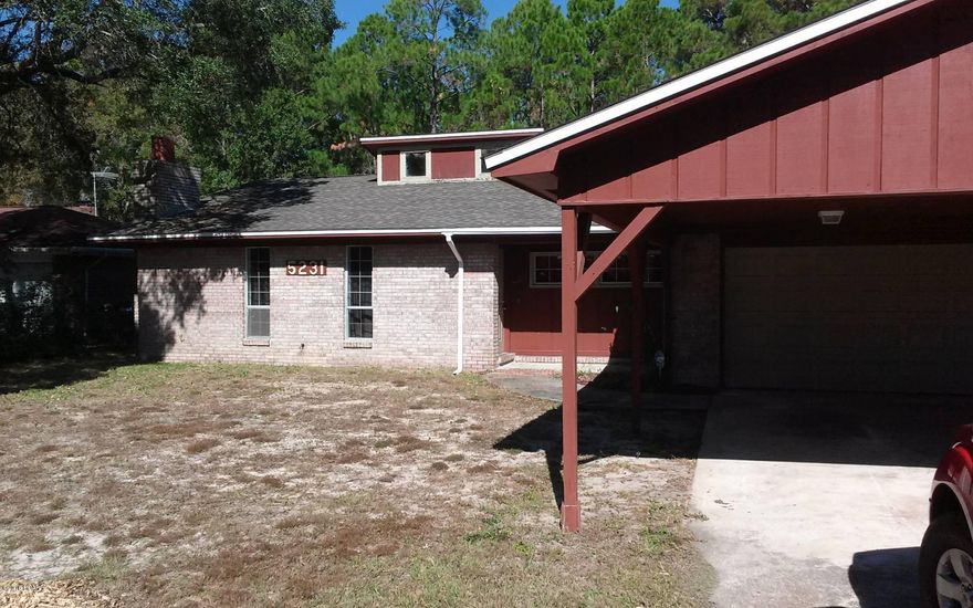 Single family home with crown molding, stainless steel appliances, custom built natural maple cabinets, side by side refrigerator, flat top stove, porcelain tile, brick fireplace, and so much more. The kitchen in this home is perfect for entertaining friends and family as it is very large. This home also has a carport and an over sized 2 car garage and a large fenced in yard, perfect for enjoying the warm Florida summers.