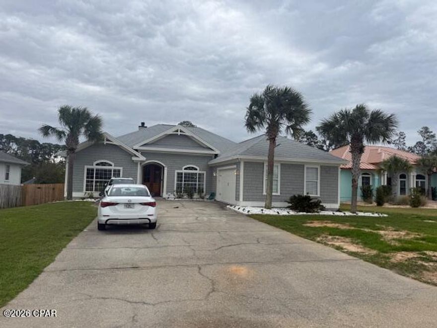 A beautiful maintained  four bedroom, 2.5 baths, minutes from the beach and bay.  This spacious property offers comfortable living with multiple bedrooms for family and guests a convenient 1/2 bath for guests.  The home is in excellent condition, featuring quality finishes, a functional floor plan and move in ready appeal.  Large fenced in backyard with a large screened in porch.  Not many homes go for sale in this awesome, no HOA's, neighborhood!