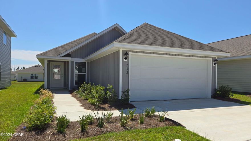 New construction home located at 6592 Kettles Street in Liberty. This 3-bedroom 2 bath, 1427 square foot home. As you step through the front entry, you will notice the open floor plan. Proceed down the entry hallway passing the laundry area and the additional bedrooms and into the open living space and kitchen. The kitchen offers a breakfast bar with space for bar seating and includes a stainless-steel appliance package with a smooth top stove, microwave and dishwasher.  The primary bedroom features a large closet with upper ventilated shelving. The bathroom offers a double sink vanity and large shower. 
 Liberty neighborhood is conveniently located in beautiful Panama City off Star Avenue near 231. Located just 25 minutes from Tyndall Airforce Base, 20 minutes to hospitals, and less than 15 minutes to shopping, restaurants, and grocery stores you will be amazed at the convenience once you enter the winding entrance to this beautiful sanctuary. Liberty, D.R. Horton's premier new lifestyle community, offers a 7,500 square foot community center with full gym, wellness rooms and much more. Additionally, behind the community center is a water wonderland with resort style pool, splash pads, and an outdoor grilling kitchen with seating.