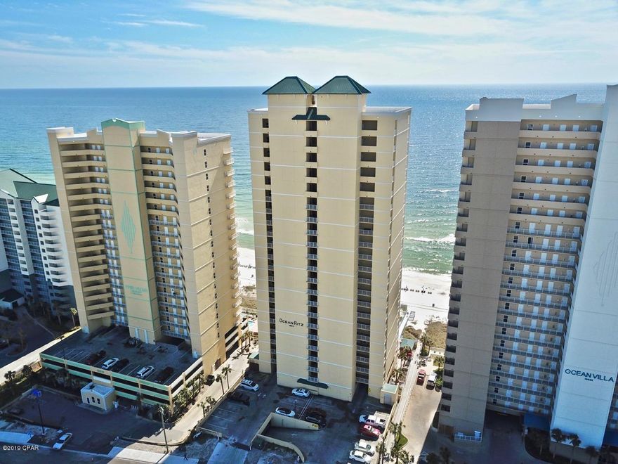 This 4 bedroom,4 bathroom, beachfront Penthouse combines the taste of luxury, quality design and construction, with pure beauty. You'll immediately notice the attention to detail, from the tasteful columns on your oversized balcony to the tray ceilings above the dining area. Conveniently located to shopping, entertainment and the best dining PCB has to offer. Highlights include, two beachfront suites both with private access to the 500 sq.ft balcony, updated flooring throughout the great room and all the bedrooms, new furniture (including memory foam mattresses), paint, fixtures and more. This unit also has a reserved parking space under the building. Open the sliding glass door and enjoy the sound of the waves crash on the white sandy beaches. With over 1,600 sq.ft of heated and cooled space you can enjoy the perfect setting for entertaining family and guests.

Other highlights include a Coastal Green Air system which conserves energy by automatically controlling the AC and water heater based on opening doors and motion within the unit, AC and water heater installed within the last 3 years. With updated appliances, granite countertops, and a breakfast bar you'll enjoy bringing out your inner chef. With only 63 units the beaches are less crowded making it easy to enjoy a long day on the beach. When you're ready to cool off head to the beach front pool or enjoy all the other great amenities that come with this lifestyle including, a fitness center, spa, saunas and 24 hour security. At the end of the day be sure to catch the breathtaking Florida sunsets from your 19th floor balcony. This unit is a must see! Call to schedule your showing today!