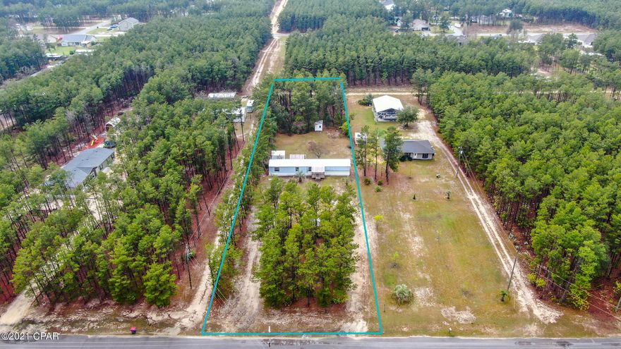 CURRENTLY UNDER CONTRACT, SELLER ACCEPTING BACKUP OFFERS - MOVE-IN READY HOME ON AN ACRE LOT IN WOODCREST! The interior features 3 bedrooms, 2 baths, an open floor plan with split bedrooms, laminate and tile floors throughout, good natural light, and an interior laundry area. The master can accommodate most king size furniture and has an adjoining bath with a large tub. The other two bedrooms are good size and share a hall bath. New HVAC! The exterior features a covered rocking chair style front deck, a large covered back deck (great for entertaining), 2 storage sheds, a sprinkler system, a metal roof, a large circle driveway (plenty of parking), and mature trees at the front and back of the property. This property has a lot to offer. Come live in a semi-country setting while also being close to town.