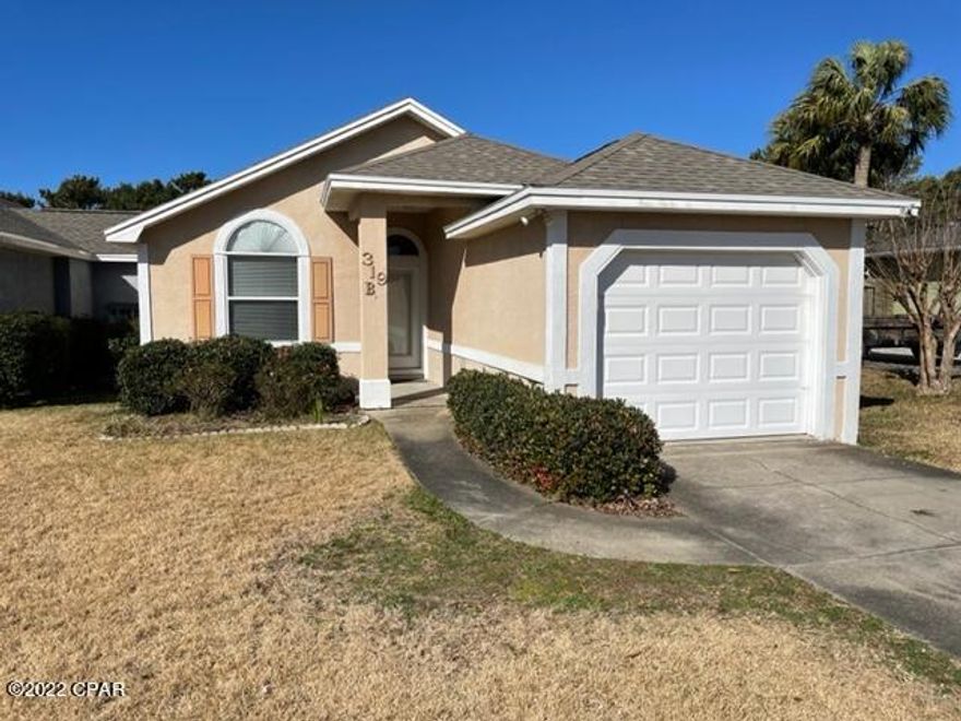 This attached home ,by utility room only is just a couple of blocks  from a dedicated beach walkover.  A spacious 2 bed 2 bath home with a Heated and cooled sunroom. Lots of parking space in the driveway and a 1 car garage. An expansive back yard with a wood deck, with a covered area and room to expand in back. Call today for your own personal tour.