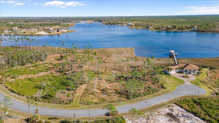 1/2 Acre Lot in the desirable, gated, Laird Point Community. This waterfront lot gives 106 water frontage feet, county states a dock is able to be built at water's edge. Pool on site! Survey on file. Good portion of lot is in Flood Zone X requiring no flood insurance if a home is built in this area. Other portion is zoned AE. Boater's & Builder's dream lot! New Construction welcome, listing agent has build information provided by seller's. Red line on photos indicates expected buildable area according to survey, as well as a dock to go over the wetlands to your boat/sitting area. Inquire for more information. 



Video: 

https://youtu.be/lv0E_Nqarig