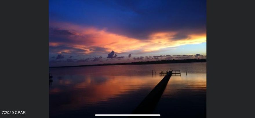 EAST BAY WATER FRONT TOWN HOME WITH DIRECT ACCESS TO GULF-  STUNNING BAY VIEWS THIS UNIT HAS NEW METAL ROOF,  PAINT -FLOORING AND DECKING THROUGHOUT- OVERSIVED GARGE ON GROUND FLOOR - GREAT FOR STORAGE OF JET SKI WATER TOYS FISHING POLES ETC.  SOME GREAT FEATURES ABOUT THIS PROPERTY: 1/11TH DEEDED OWNERSHIP OF THE DOCK AT TIME OF CLOSING, NO HOA FEES, DIRECT ACCESS TO GULF OF MEXICO, NO FLOOD INS, REQUIRED, UNIT CAN BE RENTED DAILY OR WEEKLY, NO RESTRICTIONS. WOULD MAKE A GREAT VRBO.