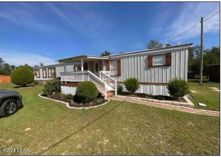 Cute fully remodeled mobile home sitting on almost an acre with two out buildings that are supremely constructed with attention paid to detail in the finishing. Fully fenced and gated for privacy.