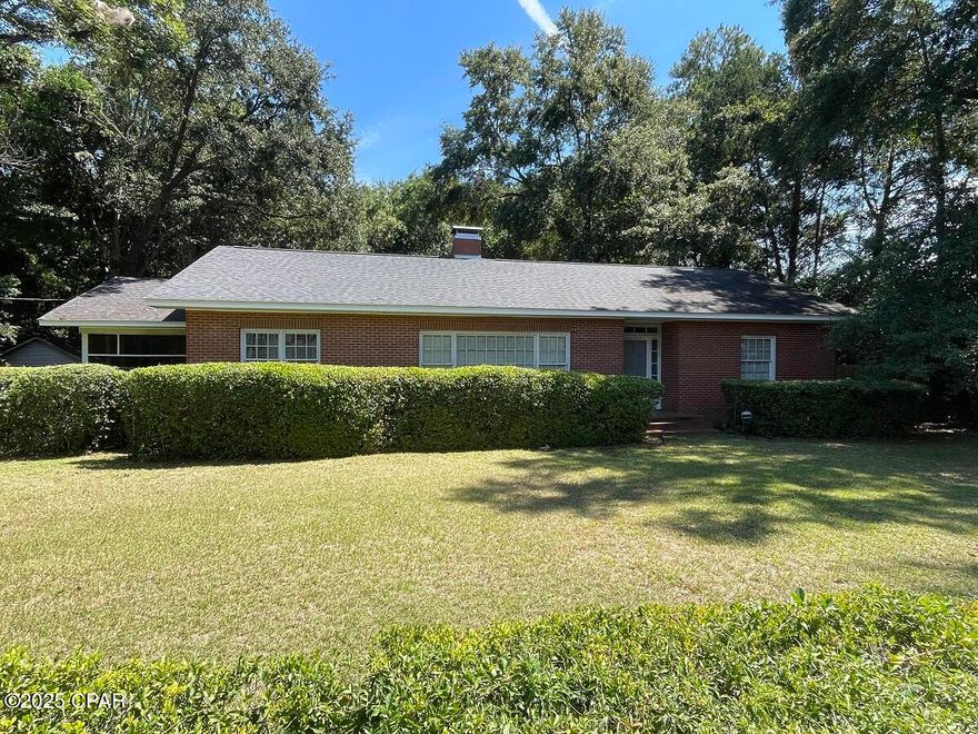 $279,500. PRICE REDUCED! Step back in time in this charming 1940 solid brick home with 1914 s.f. of living space, including 3 BR's, 2 baths, spacious eat-in kitchen, separate dining room, and separate living room with fireplace, plus 12' x 22.5' screened porch with terrazzo floor. Lovely original hardwood floors grace the entire home, except in the kitchen area and bathrooms. The kitchen has an electric stove and refrigerator with ice and water in the door. Brand new water heater installed in February. The french doors between the dining room and living room add a nice, nostalgic touch. Children or pets will find plenty of space to run and play in the large privacy-fenced back yard that is very well-shaded. The family can also enjoy cooking/eating outside on the little patio area off the back porch. This charmer is situated on over an acre in a quaint little town, with city water, sewer, and garbage collection, and it fronts on a U.S. Highway just 15 minutes from Florida's Capital City of Tallahassee. $279,500.