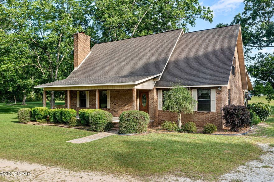 Welcome to this spacious 3 bedroom, 2 bath home that is situated on 5+/- acres of pure tranquility. Tucked away from the hustle and bustle, this custom-built split level home features a spacious living room with wood burning fireplace, formal dining room, kitchen with granite countertops, island and ample cabinet space. The primary bedroom is also located on the main level boasting a walk-in closet with custom shelving and en suite bath. Upstairs you will find 2 oversized bedrooms and full bath. Enjoy your days outdoors sipping coffee from your covered front porch, grilling on your open back deck or tinkering in your 8x19 workshop with lean-to's. This secluded find is located minutes from Hwy 77 and a short drive to Interstate 10.