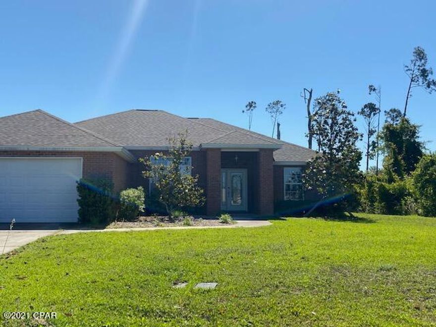 Gorgeous brick 3 bedroom, 2 bath home on a large lot in Lynn Haven! Screened back patio, fireplace, granite, shed, 2 car garage. Excellent condition, split floorpan. 1 block from Cain Griffin Park. All sizes/info/measurements approx; please verify if important.