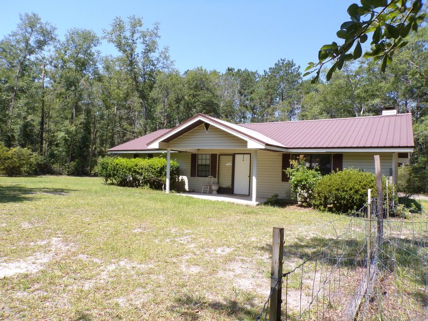 If you are looking for the PEACE and Quiet plus 

Privacy. I have just what your looking for.

 Set among some Beautiful Trees.

 I have a ranch style home with all the comforts.

  Home features a Great room with vaulted ceiling, a stone fireplace  open to Kitchen and dining area.. Has an extra large laundry room.

Enclosed Florida room to enjoy your morning coffee , looking out to a private  spacious back yard, double carport in back .

Workshop    

 Has 3 bedrooms / 2 baths.Metal roof. Not that far to the Sandy Beaches.

Call for your showing today