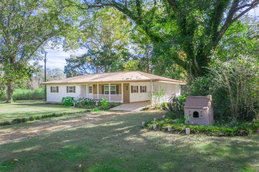 CURRENTLY UNDER CONTRACT, SELLER ACCEPTING BACKUP OFFERS - HERE'S YOUR HOME IN THE COUNTRY  surrounded by a gorgeous pecan orchard and beautifully landscaped yard!!! If that's not enough ...additional acreage with a large pond is also available for purchase.  Sellers have worked tirelessly to restore this home inside & out to include new laminate flooring, ceramic tile in main bath, kitchen cabinet doors & drawers,   self cleaning glass top range, multi-cycle dishwasher, GE garbage disposal, 40 gal. quick recovery water heater, Goodman central heat pump, whole house air injection water filtration system, four security cameras, motion activated outdoor flood lights, double pane windows, doors & vinyl siding.  There is a 33 x 14 three section barn & a 17 x 10 shed, both needing restoration