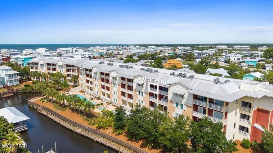 Welcome to Waterside Village Unit 410, one of the most desirable units in the entire complex, a top-floor 2BR/2BA condo with Gulf views that three out of four units here simply don't have. At 1,019 square feet, the open floor plan makes great use of the space, with the kitchen flowing naturally into the living and dining areas and featuring a breakfast bar, updated finishes, and recessed lighting throughout. The unit comes fully furnished and is move-in ready, with in-unit laundry, a walk-in closet, and elevator access, making day-to-day living as convenient as it gets. Step out onto your private balcony and take in the kind of Gulf views that are hard to come by at this price point in Mexico Beach. The building itself is HardiPlank construction on a slab with a metal roof, and the HOA covers insurance, internet, water, sewer, trash, and grounds maintenance, keeping ownership simple and low-maintenance. Waterside Village amenities include a community pool, BBQ area, boat dock, and canal access--perfect for fishing, boating, or just enjoying the waterfront lifestyle. Located right on Hwy 98 in the heart of Mexico Beach, you're a short walk or golf cart ride from the beach, dining, and everything the Forgotten Coast has to offer. Whether you're looking for a second home, full-time residence, or rental investment, this top-floor unit checks all the boxes. Call today!