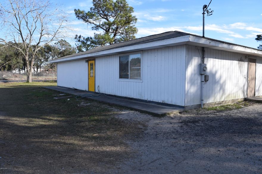 Looking for somewhere you can work out of your home and have all the space, buildings, and yard needed to run an efficient business? This might be your perfect set up! This is zoned general commercial 1, it has three buildings, all with power. There is a Quonset Hut type of building that would be great for working on cars, boats, RV's or whatever other hobby or professional interest one may have. The main structure is livable and is 1200 +/- square feet. The entire lot is fenced with a large roll aside gate access where large vehicles can easily drive in. There are not many properties in Bay County offering this type of versatility. This property is close to Tyndall and downtown Panama City is just a few miles away!