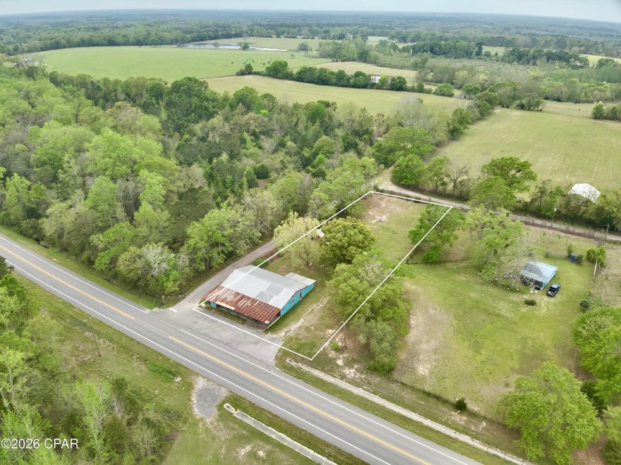 Commercial property for sale on Hwy 79 in Esto Florida - Northern Holmes County.  Main building has previously been used as a bar or entertainment venue - 4357sqft w/ small kitchen, and customer bathrooms.  

Extra enclosed pole barn in the back is used as a hobby mechanics shop.  1.1acre lot that has frontage on Hwy 79 and 2 side streets.

Spray foam insulation and HVAC