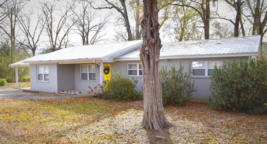 **NEWLY RENOVATED** This 4 bedroom 2 bath home has undergone a major overhaul to include new kitchen cabinets, countertops, stainless steel appliances, vinyl plank flooring, carpet, Rinnai hot water heater, interior doors, light fixtures, farmhouse trim and paint. The addition of a 12x22 master suite with full bath and massive walk-in closet. Outside updates include new metal roof, paint, windows, doors, privacy fence and attached carport. Home is located close to Hwy 90, a short drive to schools and restaurants.