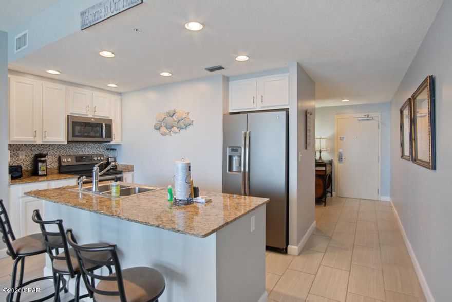 The Spotlight has stopped here! This property is sold FULLY FURNISHED, has a new HVAC and has everything you and your guests desire. Your private balcony allows you to view The Emerald Coast's green waters and the endless beach. The updated kitchen features Stainless steel appliances, a beautiful back-splash, granite counter tops and amazing shaker cabinets. Gorgeous flooring is shown throughout the deluxe sized condo. Check out the remodeled bathrooms and the amazing details added into them. The master bedroom is gulf front w/ a private entrance to the balcony. Your family and your guests will take advantage of the gorgeous heated swimming pool, sundeck, fitness center, and activity room, as well as easy beach access. A remodeled unit priced like this DOES NOT come along very often.