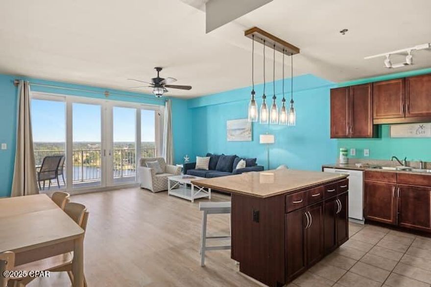 Unit 1236 MOVE IN READY AND FULLY FURNISHED! A perfect turn-key rental or a second home. NEW flooring complete and new refrigerator 2024, hot water heater 2022, flooring, lighting 2024, dishwasher 2023, sofa sleeper queen 2023, and master bed 2024. This condo is on the 12th floor with marvelous Lake views with nightly water shows. Solid rental income history. Great natural lighting. One King bed, bunk room and sofa sleeper. Sleeps up to six. The kitchen features new appliances, breakfast bar and a pantry for extra storage. The unit has been tastefully decorated with beautiful furnishings.. Enjoy a lifestyle of ease in this beautifully landscaped condominium. Laketown Wharf Resort is in the heart of all the fun in Panama City Beach and boasts 5 pools including a 10th floor roof top pool and a kiddie pool, 2 hot tubs, Large two-floor gym, private access to the beach, covered parking, nightly light water show, five restaurants, retail shops, a pool bar, pickleball court, 24 hr security and BBQ area. (Walmart across the street). Great vacation home or starter Investment Property! ** Enjoy the benefits--ON SITE of many restaurants and shops along with 810 Bowling and Billiards, Bar/Food, Ice Cream area, Arcades and so much more. Now is the time to own your piece of paradise!