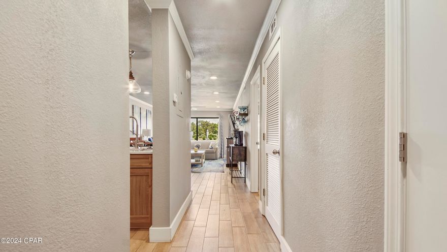 Ground floor 1-bedroom Gulf Villa, recently renovated from top to bottom. Featuring ceramic tile flooring throughout, the kitchen boasts elegant quartz countertops, new cabinets, a stylish backsplash, and modern black stainless steel appliances. The spacious living area offers a cozy feel. The bedroom provides ample space, including a desk area for remote work or for tenants needing a workspace. A barn door separates the master bath from the bedroom, and a custom-built closet offers generous storage. Enjoy the serene back patio overlooking the 9-par executive golf course. This villa is perfect as a primary residence or a vacation/investment property. There is a homeowners warranty on this unit that is transferrable with the sale.The Edgewater Beach resort offers nearly limitless amenities, including a larg oceanside lagoon pool, 10 additional seasonally heated pools throughout the property, four hot tubs, and water sports/activities. The resort also provides beach service with chairs and umbrellas, a full-service restaurant, an ice cream parlor, Starbucks, a poolside Tiki Bar, and a kids' splash pad. Other amenities include a surf & and sundries shop, a 9-hole golf course, a fitness center, and pickleball, basketball, tennis, and shuffleboard courts. The resort also features a resort-wide, free tram system that runs regularly during the summer months, making it easy to explore all the amenities.