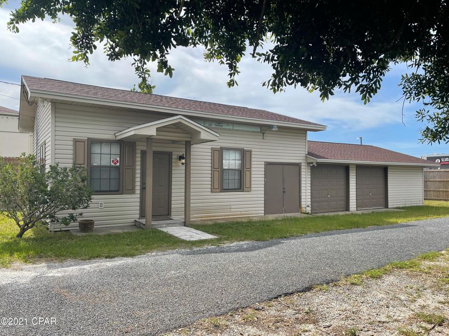 Perfect CENTRAL location for your commercial office space!  This location has 2 nicely updated offices a reception area, a kitchen area and 2 half bath's.  Seller states that bath's could be converted to 1 full bath if you need a work/live situation.  If your looking for storage, there is 1400sf of garage space and storage areas!  The office is on city water/sewer, but there is a newer septic on site and a well if you want to convert back.  Location is very close to Gulf Coast Hospital.  New roof and fence post HM. Office furnishings are negotiable.