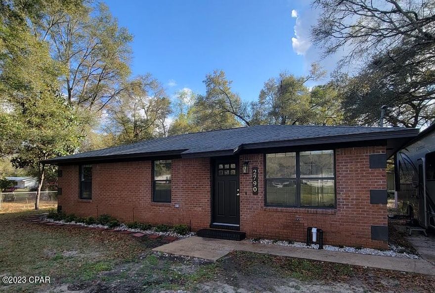 CURRENTLY UNDER CONTRACT, SELLER WILL CONSIDER BACKUP OFFERS. Looking for a private retreat, vacation home or short term rental?Look no further! This is the one you have been looking for!  This home has been completely renovated, it is private and features a  RV hookup.  This home screams location, location, location!  You will be 7 minutes to Vortex Springs, 5 min from I-10, 4 minutes from Ponce De Leon Springs State Park, 50 minutes to Panama City Beach, 50 minutes to 30A, 45 minutes to Northwest Florida Beaches International Airport.  Driveway has two entrances and was freshly graded February 2023. HVAC replaced with 2.5 ton Rheem unit, including new pad, new exterior disconnect and thermostat. Updated electrical, new lighting, receptacles and switches. Plumbing has been updated, with new tub with shower surround, new toilets, faucets, water filtration system and new hose spigots on front and back of the home.  Sewer pipes ahve been replaced.  RV hookup features 50 amp and new sewer drain.  Primary half bath boasts a 30" vanity with beautiful accents of gold set against a backdrop of black shiplap.  The guest bath has a 36" vanity with black and a touch of gold accents including black floating shelves over the toilet as well as a linen closet.  All closets have new shelving.  The kitchen has new 36" shaker upper cabinets, an oversized pantry, beautiful multicolored butcher block countertops with 4" backsplash that has been seal with a satin finsih.  Brand new LG stainless steel appliances!  The laudnry room features over the washer/dryer cabinets for additional storage.  New 40 gallon Rheem water heater complete with pan and PRV, hardwired to code.  The entire interior of the home has been freshly painted.  All new interior doors with new hardware.  Luxury vinyl plank flooring throughout that is both durable and waterproof.  New baseboards throughout the home.  All lighting interior and exterior is new LED.  The RV hookup is a great way to generate additional income!  Don't miss out on the opporutnity to call this home yours!
