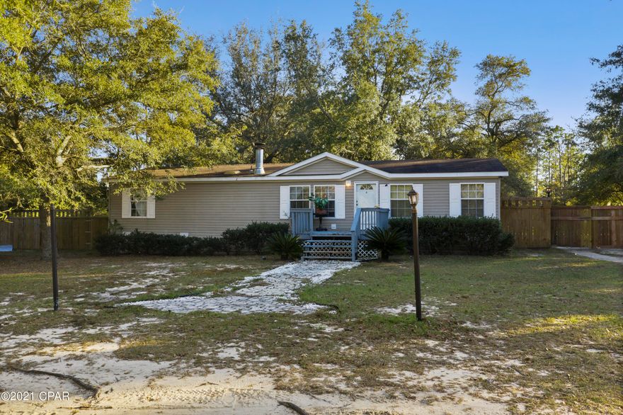 UNDER CONTRACT ACCEPTING BACK UP OFFERS

Across from Lake Denise this home sits on over an acre and features new a/c system, new well, and newer roof. This home has a cozy, rustic flare featuring rustic fixtures, wood burning fireplace, and custom distressed metal accent walls. Split floor plan. In the kitchen, overlooking the living and dining, there is plenty of counter/cabinetry space. There is also a office nook in the hall. Relax on the large covered back porch overlooking the spacious back yard. The entire backyard is fenced with chainlink fencing and privacy on the front with an automatic gated entry. 12x16 workshop with electric, shelving/cabinetry, window a/c, deep freezer, ramp, and attached carport. Hangout in the 12x20 shed w/bar, mini split w/heat, vinyl floor deck, and attached carport. Custom tree house w/electric. Inside the home there are a some light cosmetic items(trim, hole in drywall, etc.), but nothing major. Come enjoy the slower pace of life that Leisure Lakes has to offer. Including but not limited to: pavilion, grilling area, basketball, tennis, pool overlooking the lake, gated security, no motorized boats for peace and quiet, and so much more!