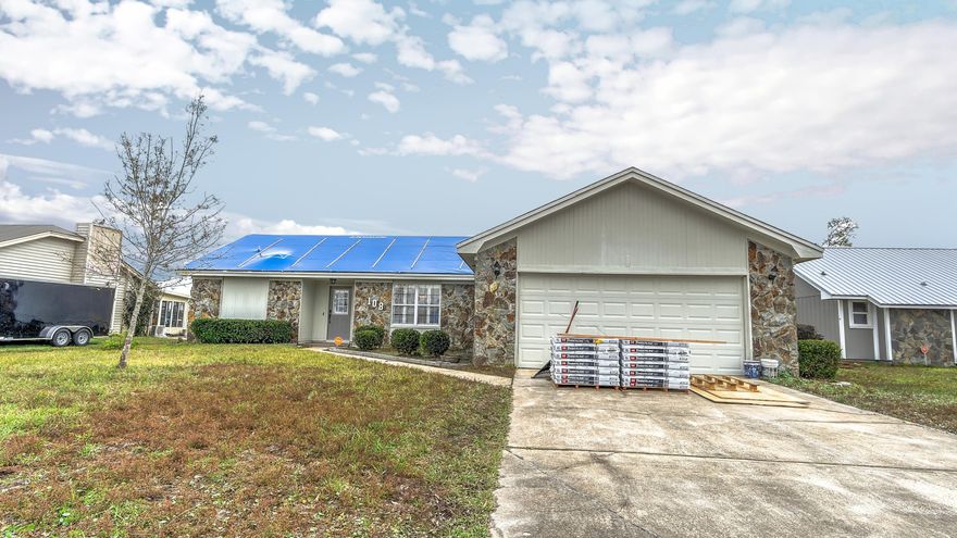 Adorable Derby Woods home that's move-in ready! This 1,600 sq ft, 3 bedroom, 2 bath home features brand new tiles in living areas and bedrooms (No Carpet!), new roof, new A/C and furnace, split bedrooms, and a beautiful wood burning fireplace. Off the spacious living room is the breakfast nook and kitchen. The dining room has plantation shutters and built in cabinets for your coffee bar and/or extra storage. On one side of the home you'll find the secondary bedrooms and a full bathroom, laundry room, and 2 car garage. On the other is the owners suite, complete with sliding doors to the backyard. The huge backyard is a blank canvas for your new pool and/or backyard oasis! All room sizes are approximate. Please verify if important.