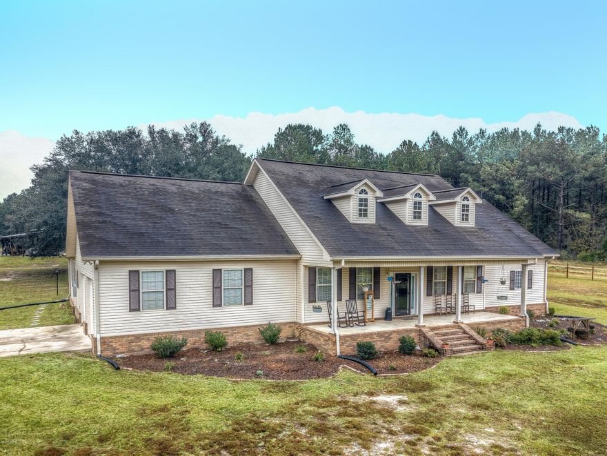 Back On Market! Financing Fell Through. Seller has Survey, and Appraisal! Hilltop Dream! This is it. The Big House on top of the hill. Nestled in a quiet, rural setting, this home sits atop 10 fenced and cross fenced acres of rolling, terraced pastureland. This home boasts a sprawling floor plan that features 5 Bedrooms and 4 Full Bathrooms, that is accompanied by a gorgeous granite filled kitchen with stainless steel appliances, and a Great Room that alone is nearly 700 sq.ft.! Downstairs features a split floor plan hosting 3 Bedrooms and 3 Baths, Kitchen, Great Room, Dining Room, Breakfast Nook, and Laundry. As you walk up stairs, you will enter the 480 sq..ft media room that has its own full bathroom, and a bedroom on each end of it. Outside, the home has large covered porches on the front and rear to catch views of both sunrise and sunset. The property is completely perimeter fenced and cross fenced and features a large, enclosed barn with leans on 3 sides. Outside the barn, is a fire pit with seating that will come in handy on those cool nights. There are just too many features to list. Schedule your viewing today to see this amazing home!