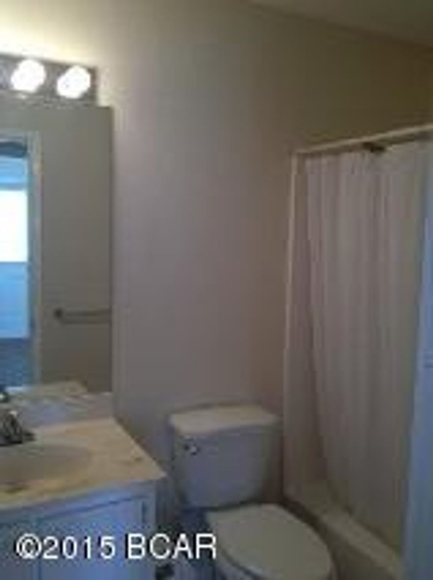 Just Two Blocks from the Beach.  This is a 3 bedroom 1.5 bath town home located in the Thomas Drive area, and a short walk to the beach.  This unit features a kitchen/dinette combo, covered front porch, 2nd level deck off of bedroom 2, and a small storage closet on the ground level.