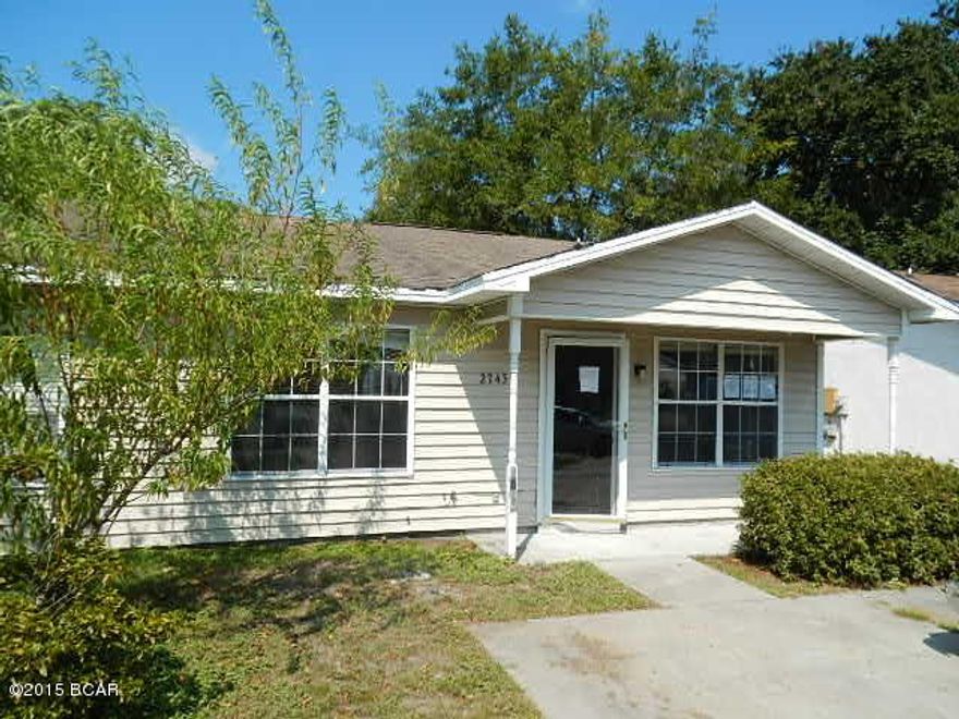 1/2 duplex offers a privacy fenced backyard, formal living room, 2 spacious bedrooms w/reach-in closets, cute kitchen adjoining the dining area, and a nice neighborhood w/sidewalks and fenced playground w/lighting. Convenient location tucked in between 5th St. and 15th St. blocks from Joe Moody Harris Park, local schools, and Bay Medical Center.  Plus, this home is a super easy 15 minute drive to Tyndall AFB! EQUAL HOUSING OPPORTUNITY.