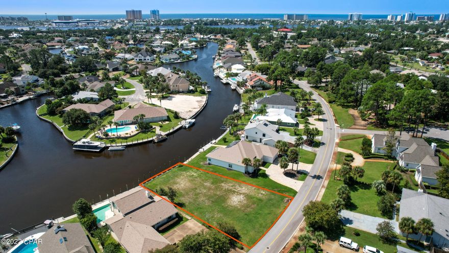 Rare opportunity to own a stunning waterfront homesite in the highly sought-after gated community of Bay Point in Panama City Beach. Perfectly positioned along the canal with direct access to the Grand Lagoon and Gulf, this spacious lot offers the ideal setting to design and build your custom coastal home.

Enjoy beautiful water views, gentle breezes, and the ultimate Florida lifestyle right from your backyard. The seller has recently installed a new vinyl seawall and pylons, offering added value and peace of mind for future construction and boating. In addition, the seller has stunning house plans in hand for a thoughtfully designed 3,400 sq. ft. residence, giving buyers a head start on creating their dream waterfront home.

With ample space to accommodate a private dock, outdoor living areas, and a custom residence, this property provides endless possibilities for creating a luxury coastal retreat.

Located within Bay Point, a premier gated golf cart-friendly community, residents enjoy access to world-class amenities including a championship golf course, marina, tennis courts, and 24-hour security. Conveniently situated just minutes from beaches, dining, shopping, and St. Andrews State Park.

Whether you're looking to build a full-time residence, second home, or investment property, this exceptional lot offers both location and lifestyle. Don't miss this chance to secure one of the few remaining waterfront lots in Bay Point.