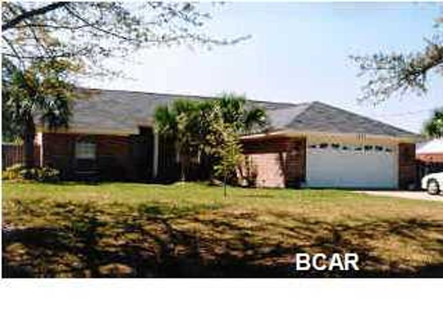 HERE COMES SUMMER...You can go swimming everyday in your enclosed pool at this large brick home coveniently located in Lynn Haven. The back yard is very private with lovely landscaping and a pond that borders the back yard. Home has great living space including a living room with fireplace, a 20 x 28 Florida room, and a screened porch. The large updated kitchen has field stone countertops, and the breakfast nook area has great views of the outside. The large living room and dining area have gorgeous hardwood floors. The split bedroom plan offers a large Master suite with walk in closet and a walk in soaking tub with shower. Home has a heat pump, a tankless water heater, and a saltwater generator for the pool. Pool maintenance is included in the rent. Available for showing 5/16/15.