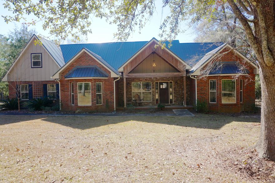 This home is sure to impress with its inviting front porch that leads into an open living area with beautiful vaulted stained wood ceilings. It features a stone fireplace and a staircase leading to the bonus room (could be used as 4th bedroom). The kitchen features granite countertops, stainless steel appliances, bay windows, a large pantry and breakfast bar. The master bedroom has trey ceilings, a bay window, and large walk-in closet. The master bathroom features a double vanity and large walk-in shower with wall mounted and ceiling mounted shower heads. The  bonus room is a large functional space with a full bathroom and closet areas. There is a 2 car garage with another bonus room above it. This home is in a neighborhood that offers privacy and is surrounded by large beautiful trees