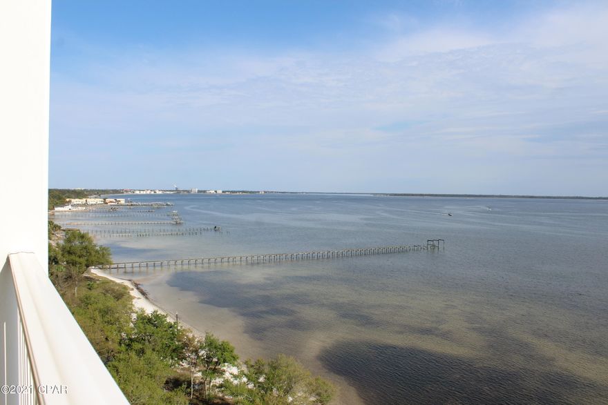 Amazing views and ideal location of this updated 2 bedrooms, 2 1/2 baths, gated, bayfront condominium make it the perfect place to call home!  Avoid the beach traffic and enjoy the park like setting and strolling through Historic St. Andrews.  You can watch the bay activities from the living room, dining room and master bedroom. Unit features: new hurricane code windows & sliding doors (South side); updated kitchen (custom wood cabinetry, granite countertops with bar extension, extra cabinets under the bar, double oven, upgraded micro); tile in living space; new carpet in bedrooms; new drywall and paint in most of unit; laundry room. Amenities: bayside pool, clubhouse, exercse room, dock, marina, covered parking, sandy beach. Owners may have a pet. No short term rentals. All measurements and dimensions are approximate.  If important to buyer, please verify. Easy to see so come check it out!