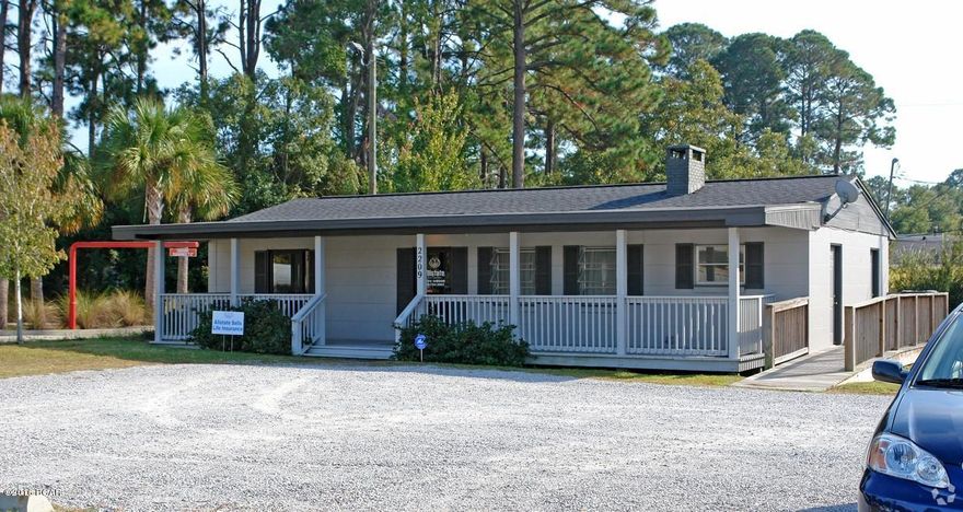 Zoned C2 commercial and perfectly positioned, this 1,620 square foot

commercial office building is located on one of the busiest corridors in Panama City, 15th Street.

Located on quarter acre (.25+/-) lot with 87 frontage feet, this building is constructed of concrete block and offers ample parking for a growing business.

Building consists of a large 20x15 lobby area and customer reception, two offices, one bathroom, kitchenette, and storage room.  Depending on customer preference, the storage room could be converted to a third office.

In addition to being constructed of durable concrete block, this office contains wood ceilings and a brick fireplace in the reception area which warms and creates a very nice feel for customers. Handicapped access ramp is located on the west side of the building.
Large covered porch located on the front of the building.
There is also a porch located on the back of the building which could be a nice employee break area.