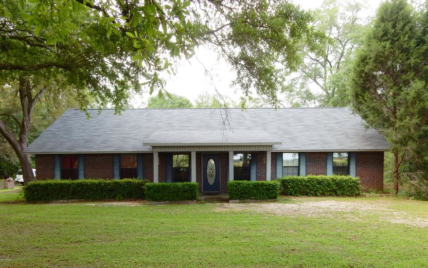 This 3/2 Brick Beauty is nestled on 8.78 acres with stocked fish pond, fenced and cross fencing for livestock, 32X48 pole barn, above ground pool and 3 car attached carport. Inside features include split floor plan, large walk-in closets in all bedrooms, spacious bathrooms and kitchen/dining combo with breakfast bar. Roof and HVAC have recently been replaced. Additional land in front of home could possibly be purchased. Property is located between Cottondale and Graceville, just a short drive to Dothan.