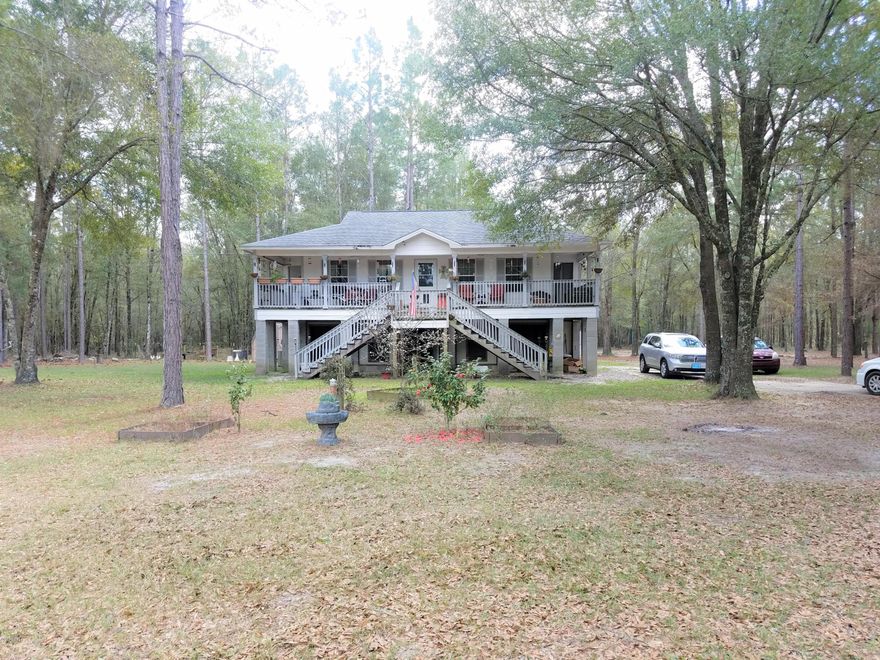 Great three bedroom, two bath home on 10+ beautiful acres in a quiet neighborhood with plum, pear, apple, fig, and peach trees. The 10 acres of timber would make for prime hunting land as it already has two shooting houses on the property! Bottom level is 30x40 enclosed split with garage and bonus could be converted to another bedroom, already insulated and plumbed. This house is move in ready with new central air unit, stove, refrigerator, and the washer/dryer are staying! 2016 Central Air unit has a ten year transferable warranty. New well and pump in 2010. 20 additional acres available for purchase. Property also features a huge two bay shop with roll up doors, insulated with heat/ac, and tank-less hot water heater. Make your appointment to see it today!