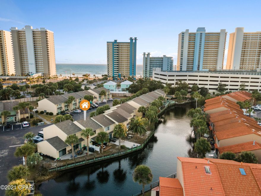Only 4 minute Beach walk!!! This is a 2 Bedroom 2.5 bath ''Glassback'' townhouse located in Gulf Highlands Beach Resort - one of the most popular family-oriented resorts in Panama City Beach. No waiting for an elevator or looking for a parking spot in an enormous parking garage here! This townhome features 2 bedrooms with on-suite baths, backs up to a canal, and lush surroundings with one of 11 pools right across from this unit. Not one but 2 assigned parking spaces right outside of your front door. Recent updates include a custom walk-in shower, all new floors upstairs, water heater replaced in 2017, A/C in 2020, roof-2017, new gutters-2020, new toilets-2019, dryer-2019, All new outlets and switches in 2018. Gulf Highlands Beach Resort is a gated community, offers many amenities including a Beachside Pool & Clubhouse, 11 other pools (5 Heated), 4 tennis courts (2 Lighted), 18 Hole Mini Golf, shuffleboards, dedicated beach access with beachside pool and clubhouse. Best of all is a low Home Owner's Association fee of only $233 per month that takes care of all these great amenities! Age, Square Footage, HOA fee, and room sizes approx., if important please verify.