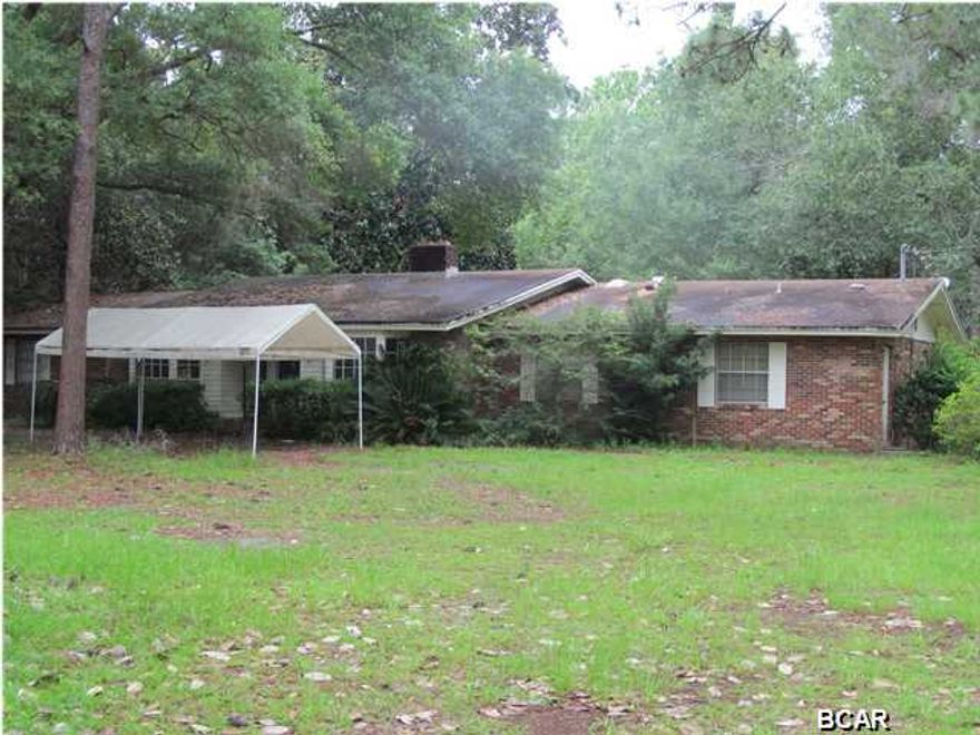 The house and property is being sold AS-IS. The house is tenant occupied. The acreage is an approximation, a boundary survey will be accomplished by the seller to establish exact boundary dimensions and overall acreage. All room dimensions are approximates. If you are looking for country living in town this property is perfect for you, with mature natural forested surroundings and creek frontage. Also see MLS #'s 611131 & 611120 for other buying options.