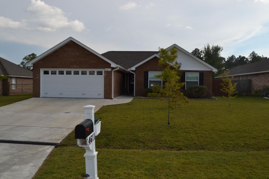 Gorgeous, like new 3 bedroom 2 bath home located in one of Bay County's most popular neighborhoods, Bylsma Manor.  This all brick home was built by a local builder with an eye for quality and detail throughout.  The open floor plan features a large kitchen with solid wood cabinets and solid surface counter tops, a breakfast bar, full stainless appliance package and a formal dining area.  The living room is open to the kitchen and features a corner fireplace and hardwood floors. There is a bonus room just off of the living room that would make a great office, study or media room. The master bedroom has a large walk in closet and a very luxurious double shower in the bathroom as well as double vanities.  Both bedrooms 2 and 3 share a full bath.  The 2 car garage has plenty of extra storage for hanging tools storing yard equipment.  The back yard is fully privacy fenced and has an outdoor shower.  This home shows like a brand new one but has a better price!  Call today for your private viewing.