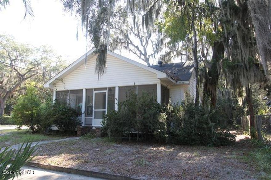 Charming home in Historic Cove area with two bedrooms, a study and one bathroom.  The oversized living room and formal dining area provide ample space for entertaining.  Additional seating is available in the spacious kitchen.  Under the carpeting in living/dining area are original hardwood floors!  The screened front porch is a perfect location for a morning read.  Nice sized back yard currently houses a garage with carport.  Property updates done in early 2000's include: roof, windows, doors, wiring, HVAC, as well as new cabinets and plumbing in the kitchen.