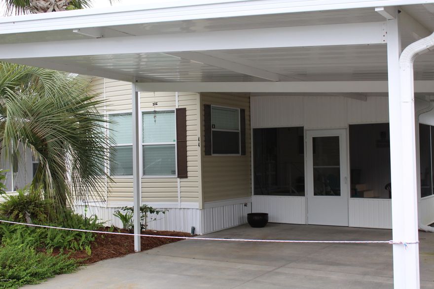 Come see this lovely home that is move in ready.  Location, Location, Location.  Home has vaulted ceilings throughout.  Bay Window in Family Room with built in cabinetry for TV and storage. Family Room can also be enclosed with a slide divider for privacy if needing an extra sleeping area.  Kitchen is open and spacious with breakfast area.  Large Screened-in porch for relaxing.  Spacious Two Car carport for added convenience.  Emerald Pointe is a gated community with two pools, hot tub, playground, clubhouse, shuffleboard and pond for fishing.  Golf Cart Friendly and Property Close to the Beach.