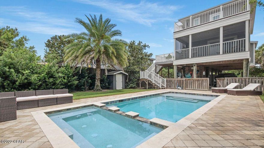 Stunning beach home approximately 1/2 mile from the beach!  Unique & charming and never rented. 3 bedroom, 3 bath with an inground pool.